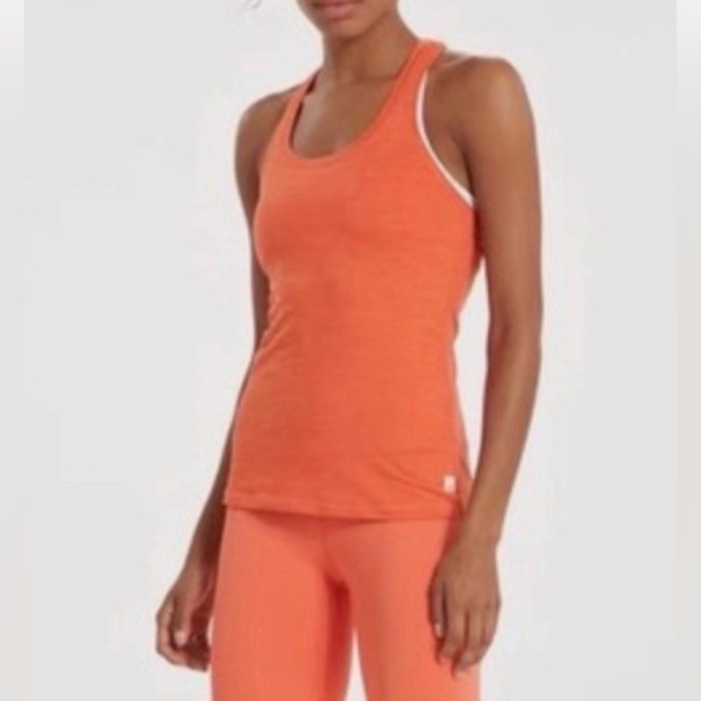 Vuori racer back tanktop in color orange. Women’s size large
